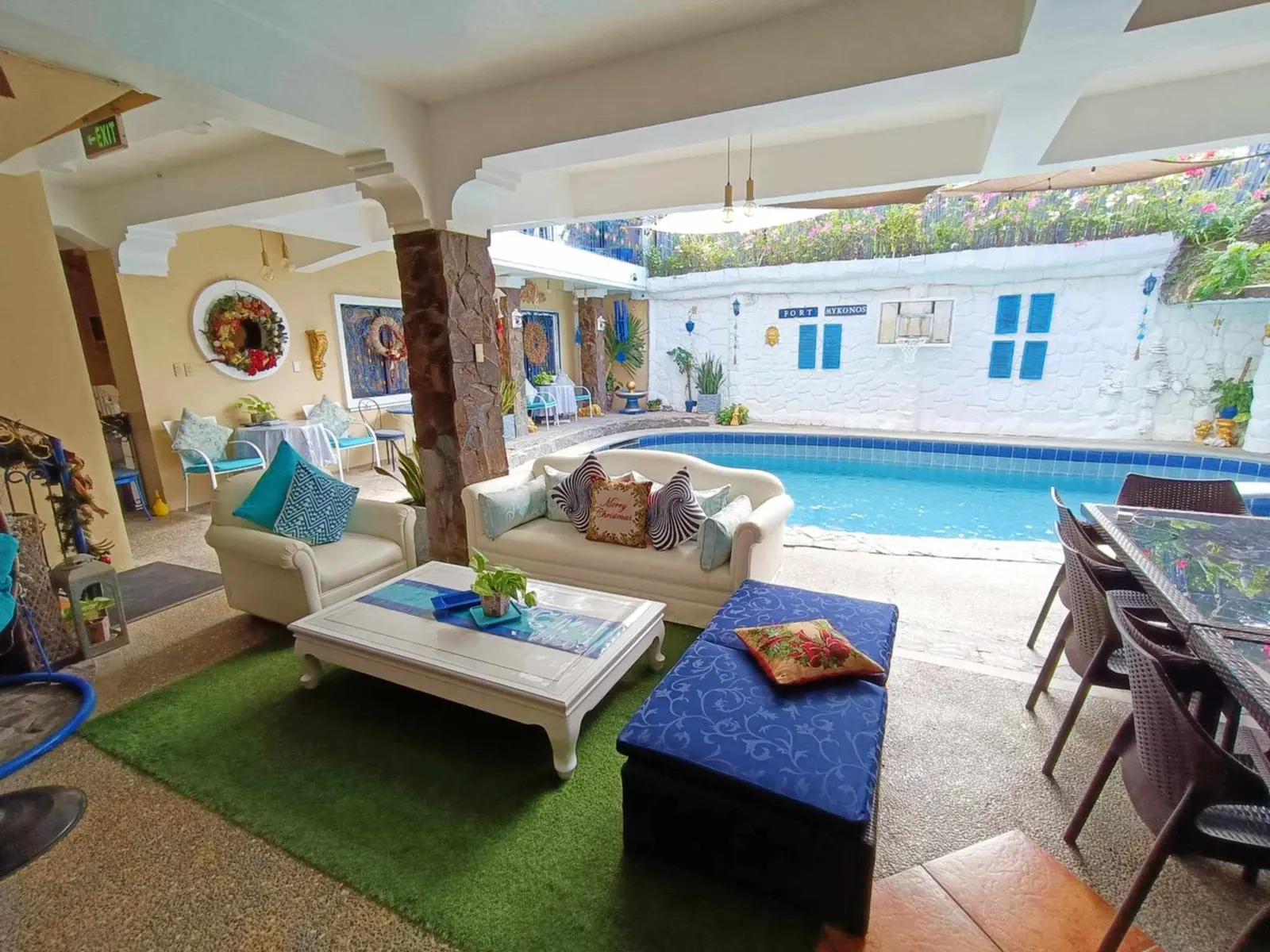 The Fort Mykonos lounge and dining area facing the pool