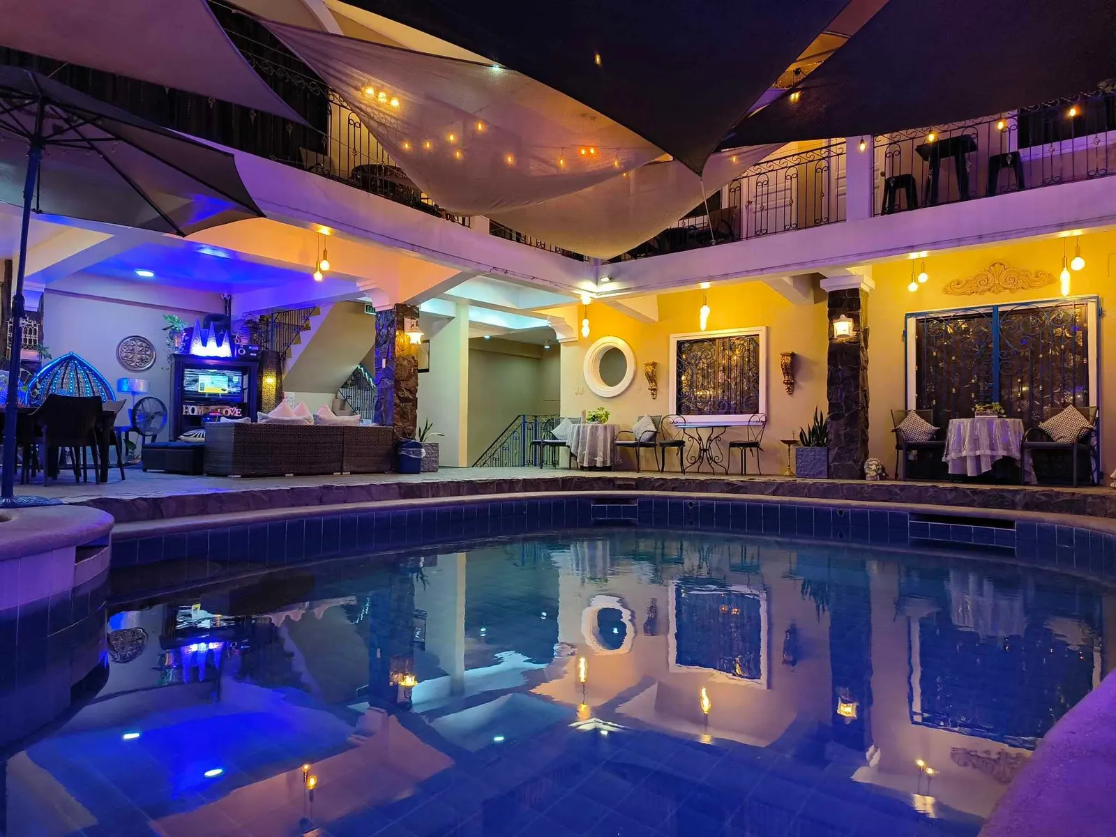 The pool lit blue at night