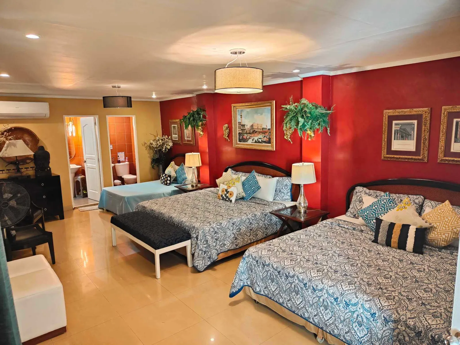 Red room with two double beds