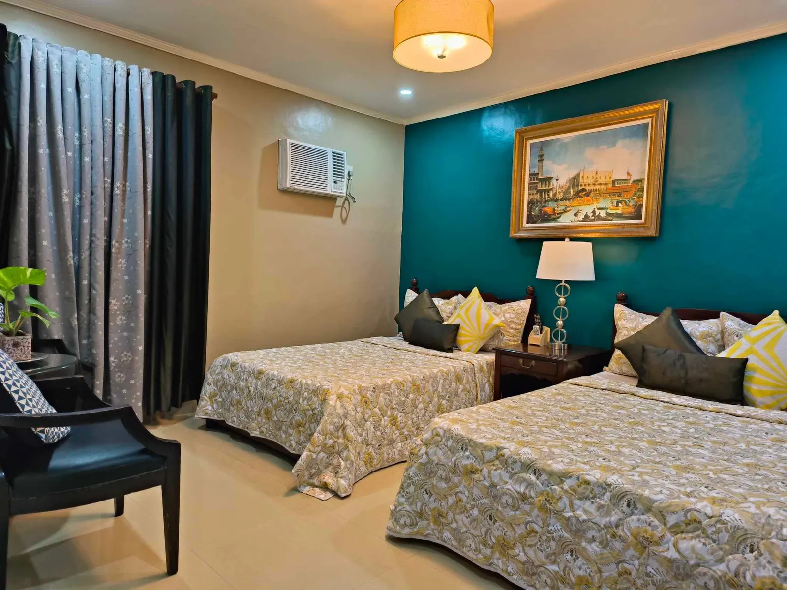 Teal room with two beds
